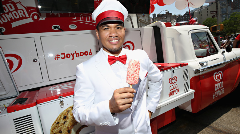 good humor truck and man holding strawberry shortcake bar