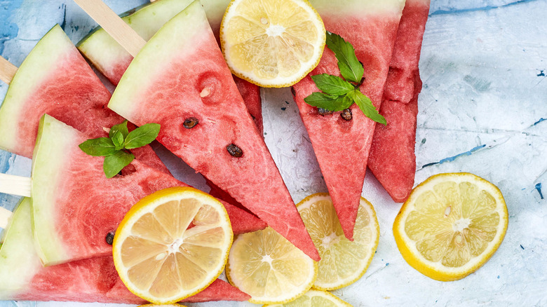 watermelon pieces on sticks with lemons 