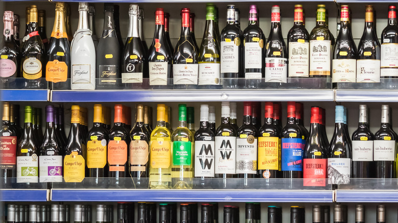 rows of wine and liquor bottles in store