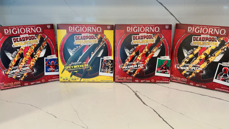 Four Digiorno pizza boxes lined up