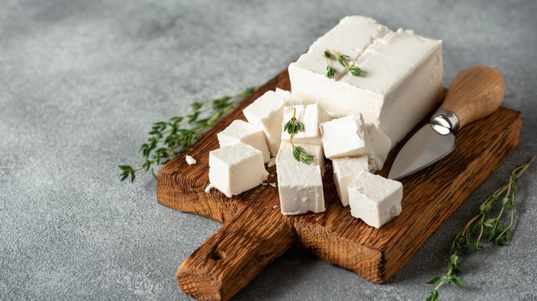 block of queso fresco on wooden board