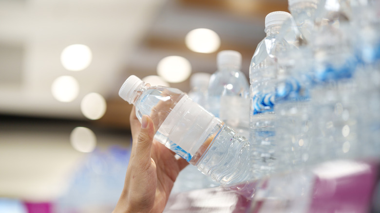 Shopper grabbing water bottle