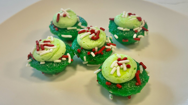 five bite-sized pickle cupcakes on a plate