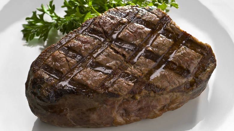 cooked steak grill marks garnish