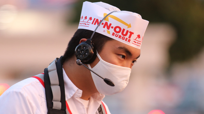 in-n-out worker taking order