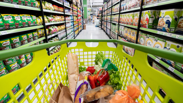 Shopping cart in grocery aisle