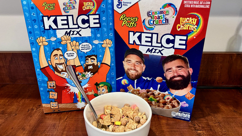 Two cereal boxes behind a bowl of cereal