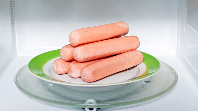 Stack of hot dogs in microwave