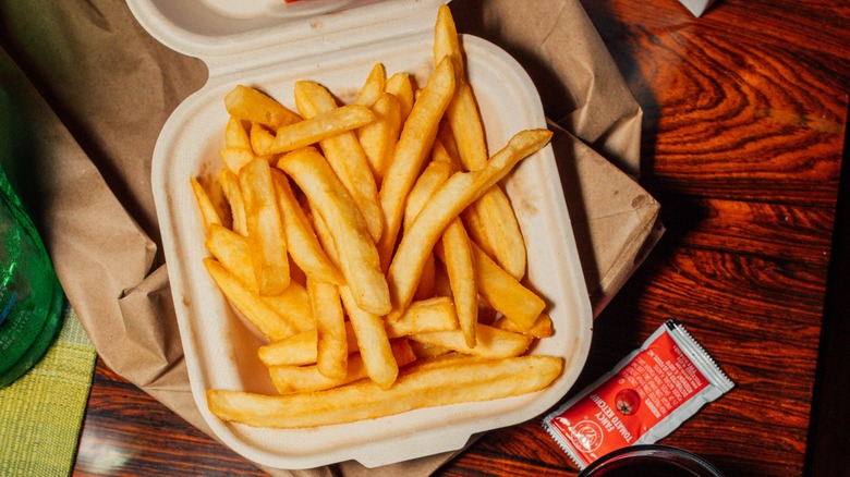 French fries in takeout container