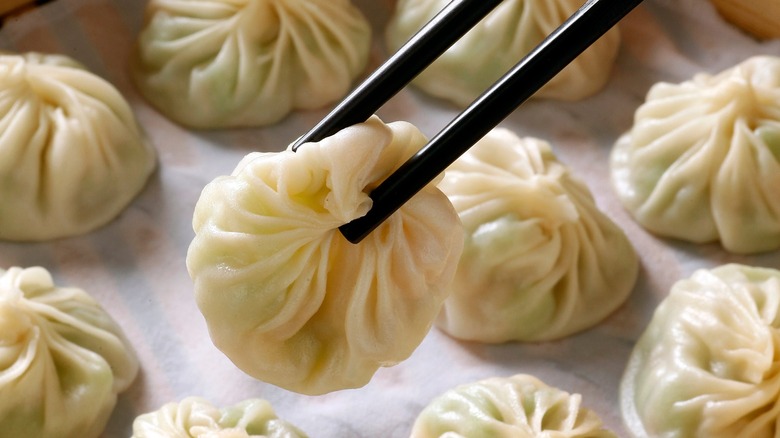 xiao long bao in a bamboo basket